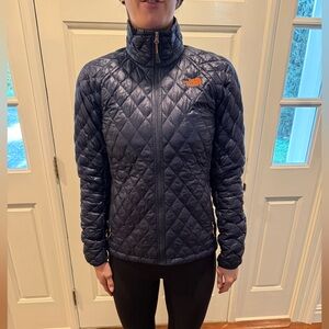 The North Face Navy Quilted Jacket with Orange Logo
